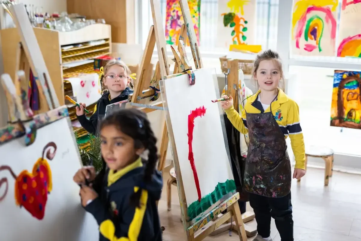 Three girls are painting